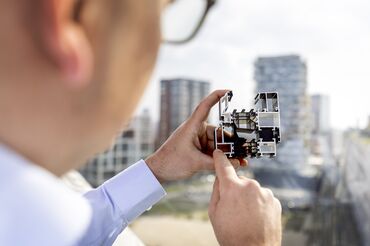 Architect examining aluminum window profile cross-section