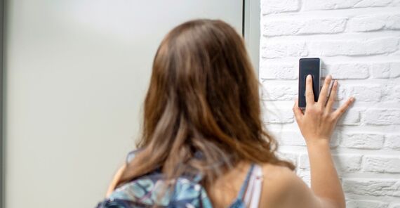 Smart building demonstration with a girl using fingerprint scan to open door